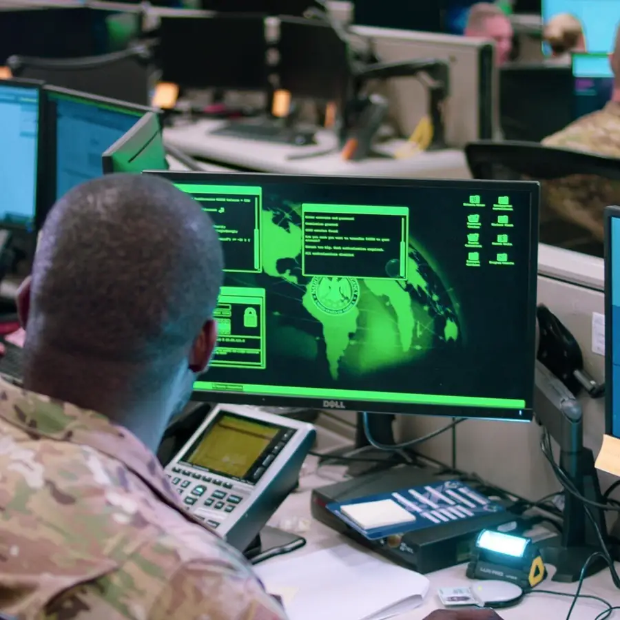 Cyber operators watch network defence displays at Port San Antonio.
