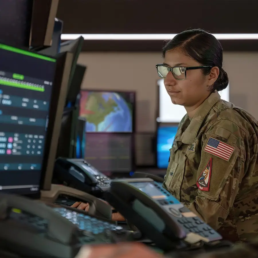 A Guardian monitors a workstation in the Combined Space Operations Center.